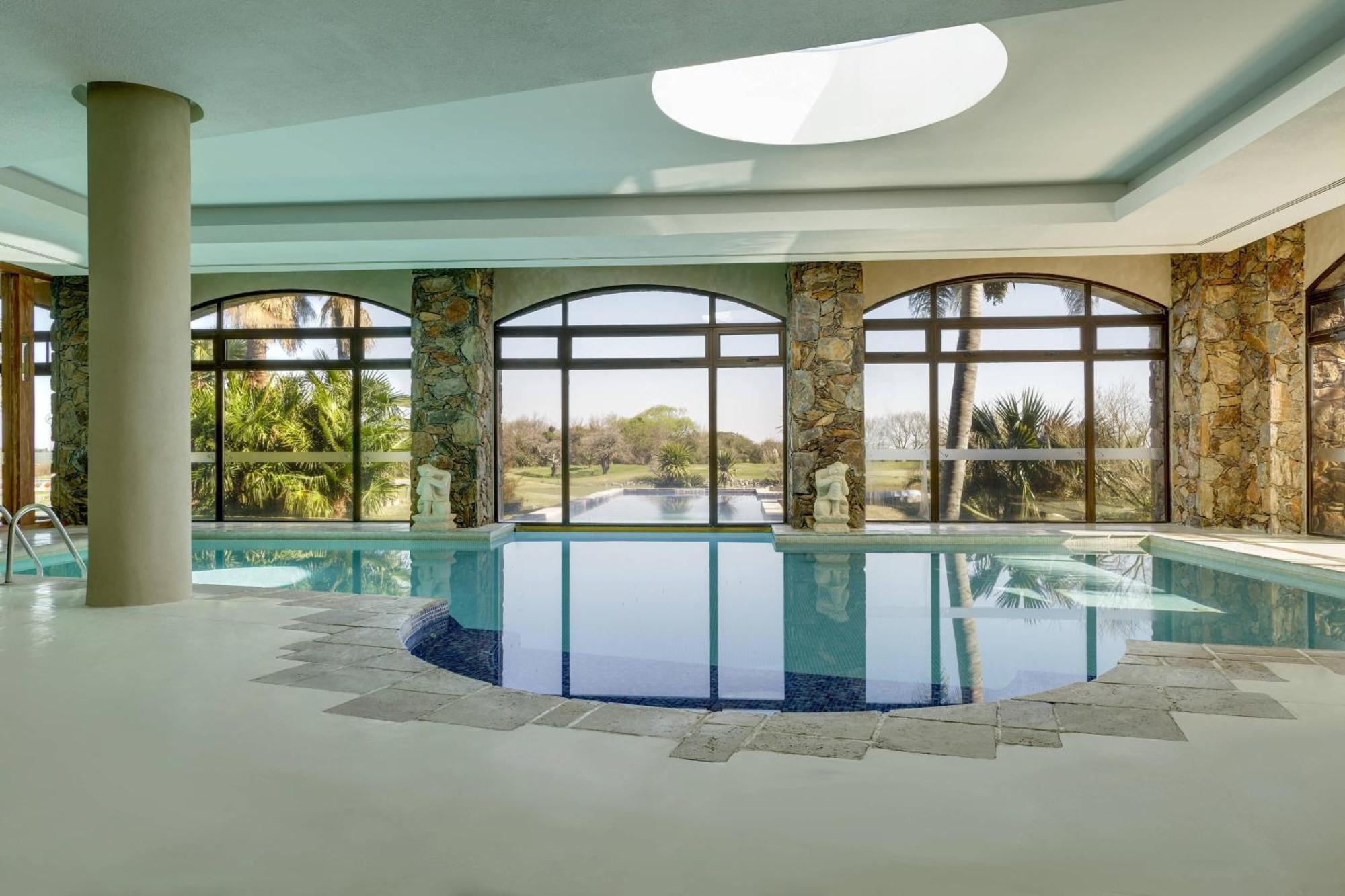 쉐라톤 콜로니아 골프 앤 스파 리조트 콜로니아델사크라멘토 외부 사진 The swimming pool at the hotel